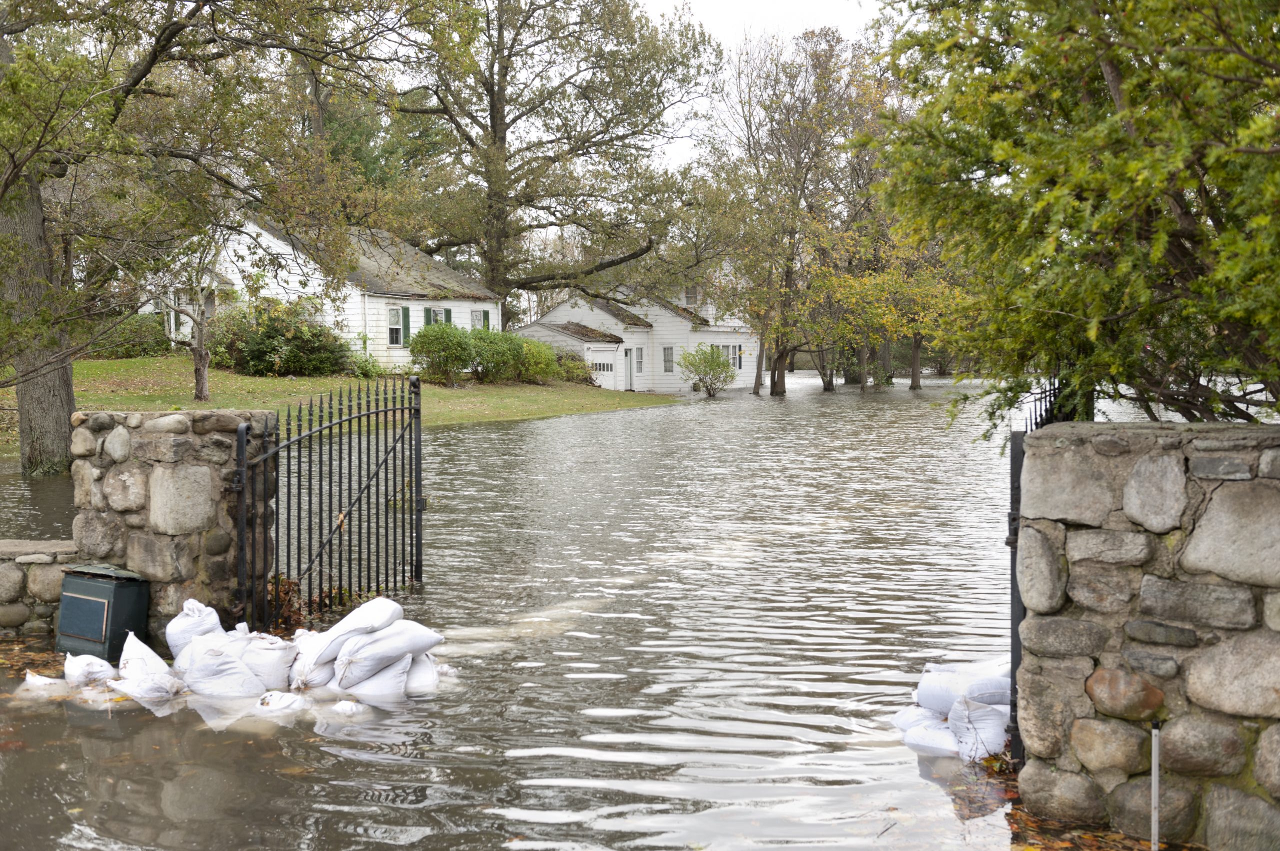 A flooded road in an oceanside community in New England after Hurricane Sandy